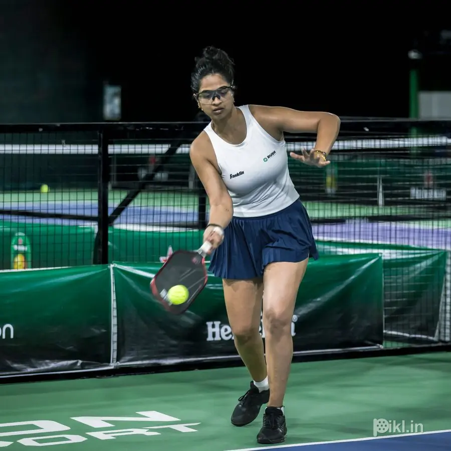 Backhand taken at the net in front of the boards